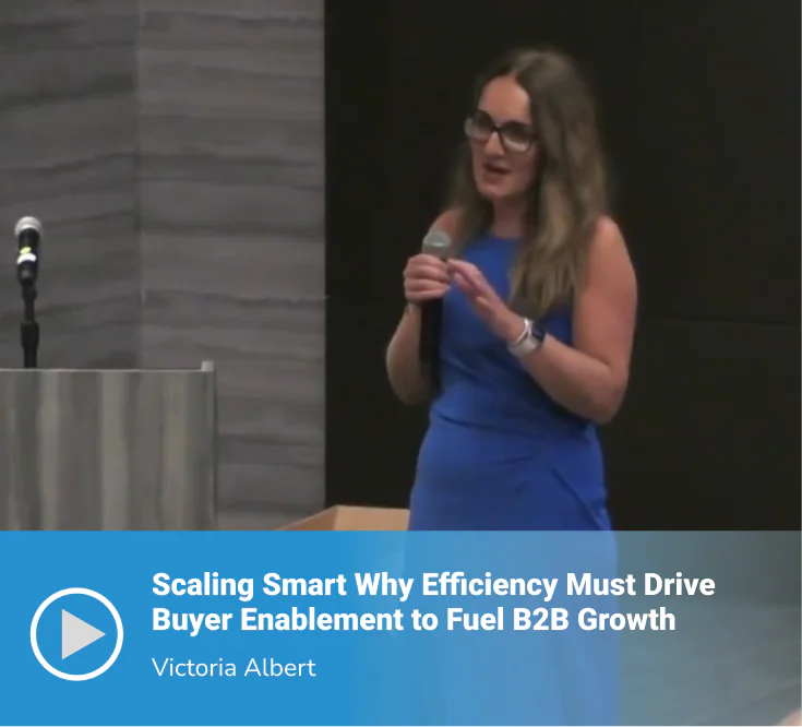 Video thumbnail of a session titled "Scaling Smart Why Efficiency Must Drive Buyer Enablement to Fuel B2B Growth" featuring speaker Victoria Albert presenting on stage in a blue dress, holding a microphone.