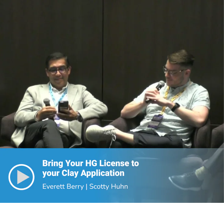 Video thumbnail of a panel discussion titled "Bring Your HG License to your Clay Application" featuring speakers Everett Berry and Scotty Huhn seated on stage, both holding microphones, against a dark wood-paneled background.